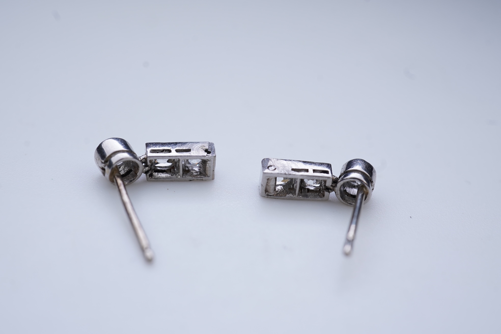 A pair of diamond earrings, early 20th century composite
